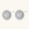 Double halo sterling silver stud earrings with brilliant round moissanite center stones and pavé crystal accents