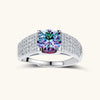 Sterling silver adjustable ring with brilliant round moissanite center stone and pavé diamond band showing rainbow fire