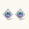 Diamond-shaped sterling silver stud earrings with rainbow moissanite centers surrounded by crystal halos