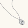 Sterling silver necklace featuring a large pear-shaped moissanite stone in an ornate setting with smaller accent stones