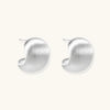 Brushed sterling silver cushion-shaped stud earrings with matte finish on white background