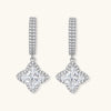 Sterling silver huggie hoops with geometric diamond-shaped moissanite dangles featuring pavé crystal details